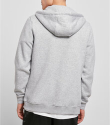 Build-your-Brand_Heavy-Zip-Hoody_BY012_lifestyle_Heather-Grey_back